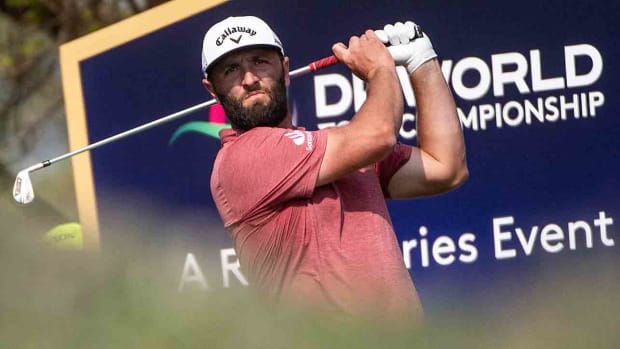 Jon Rahm of Spain tees off at the 11th hole during the 2023 DP World Tour Championship in Dubai, United Arab Emirates.